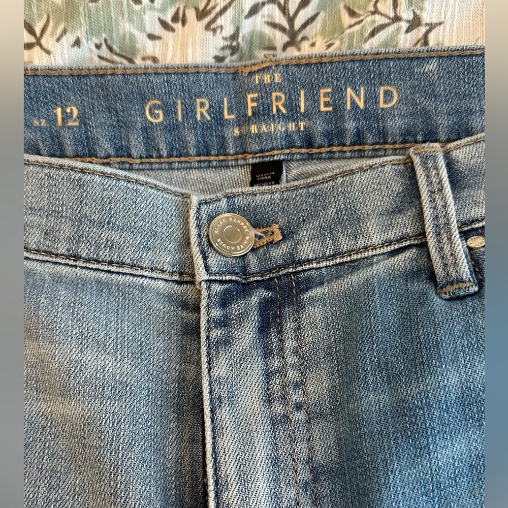 Women’s distressed girlfriend light blue jeans.